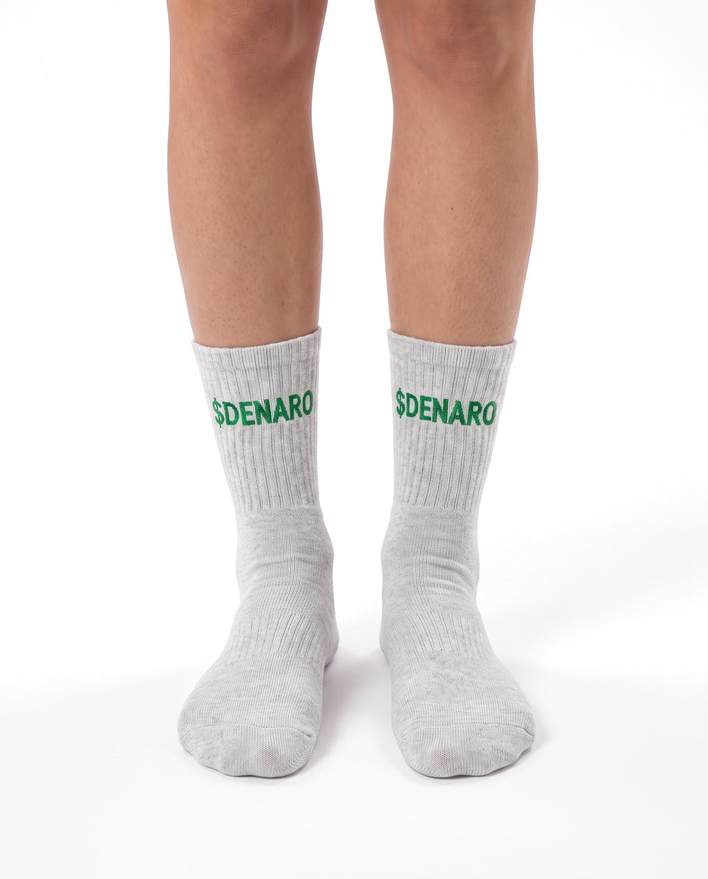 Model wearing Denaro crew socks in heather grey, standing