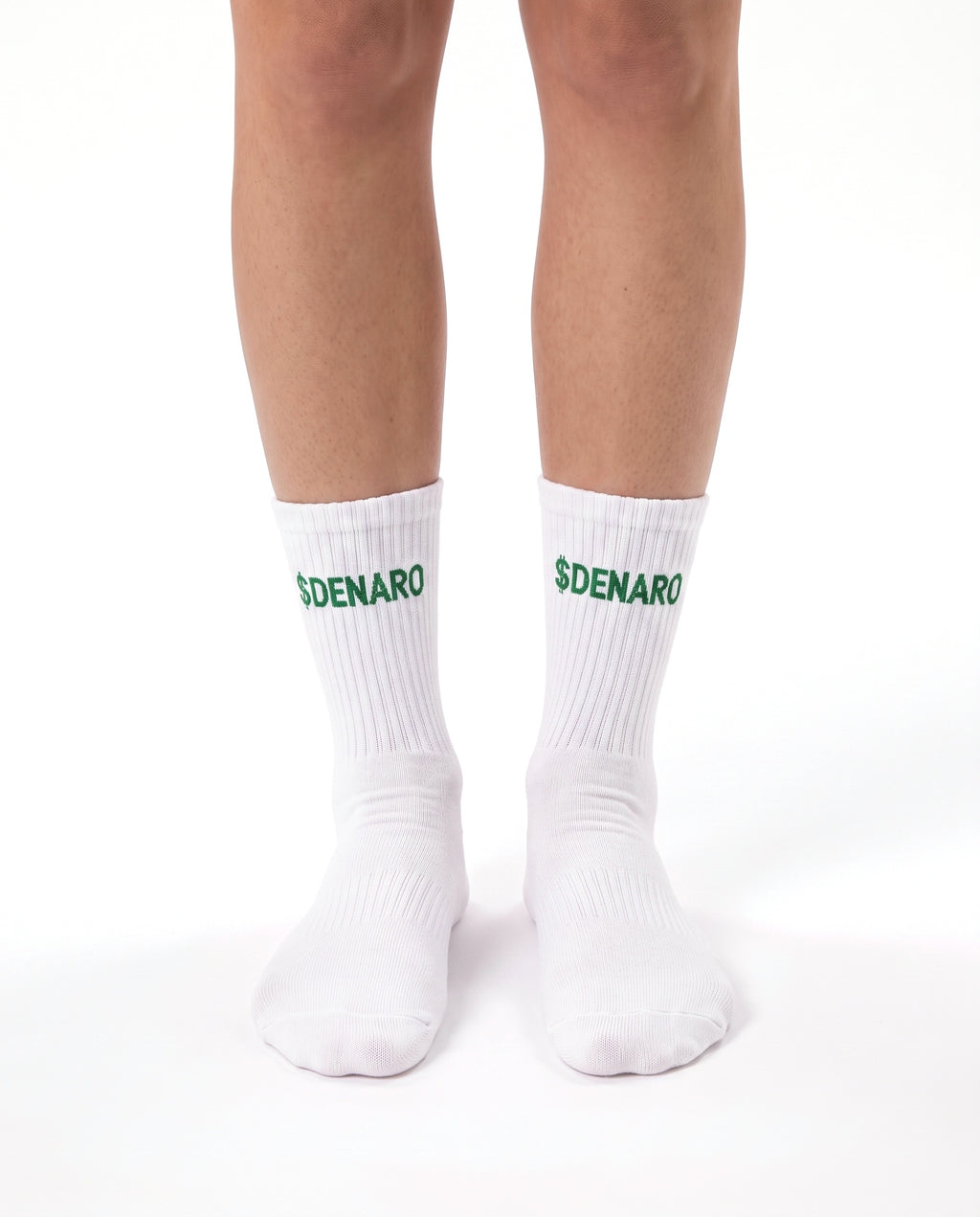 Model wearing Denaro crew socks in white, standing